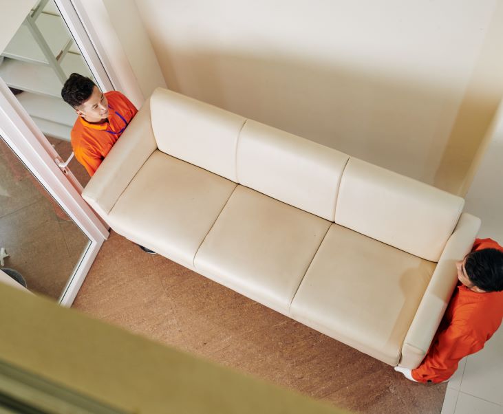 movers carrying sofa